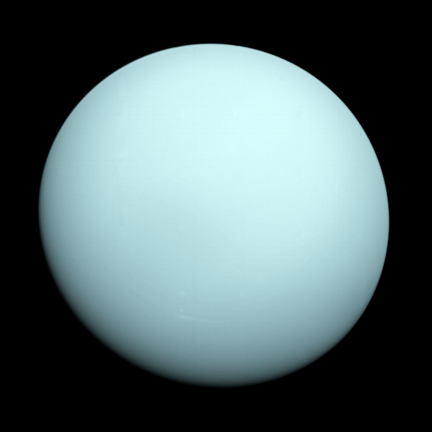 Uranus as seen by Voyager 2 — a nearly featureless, smooth pale blue-green globe
