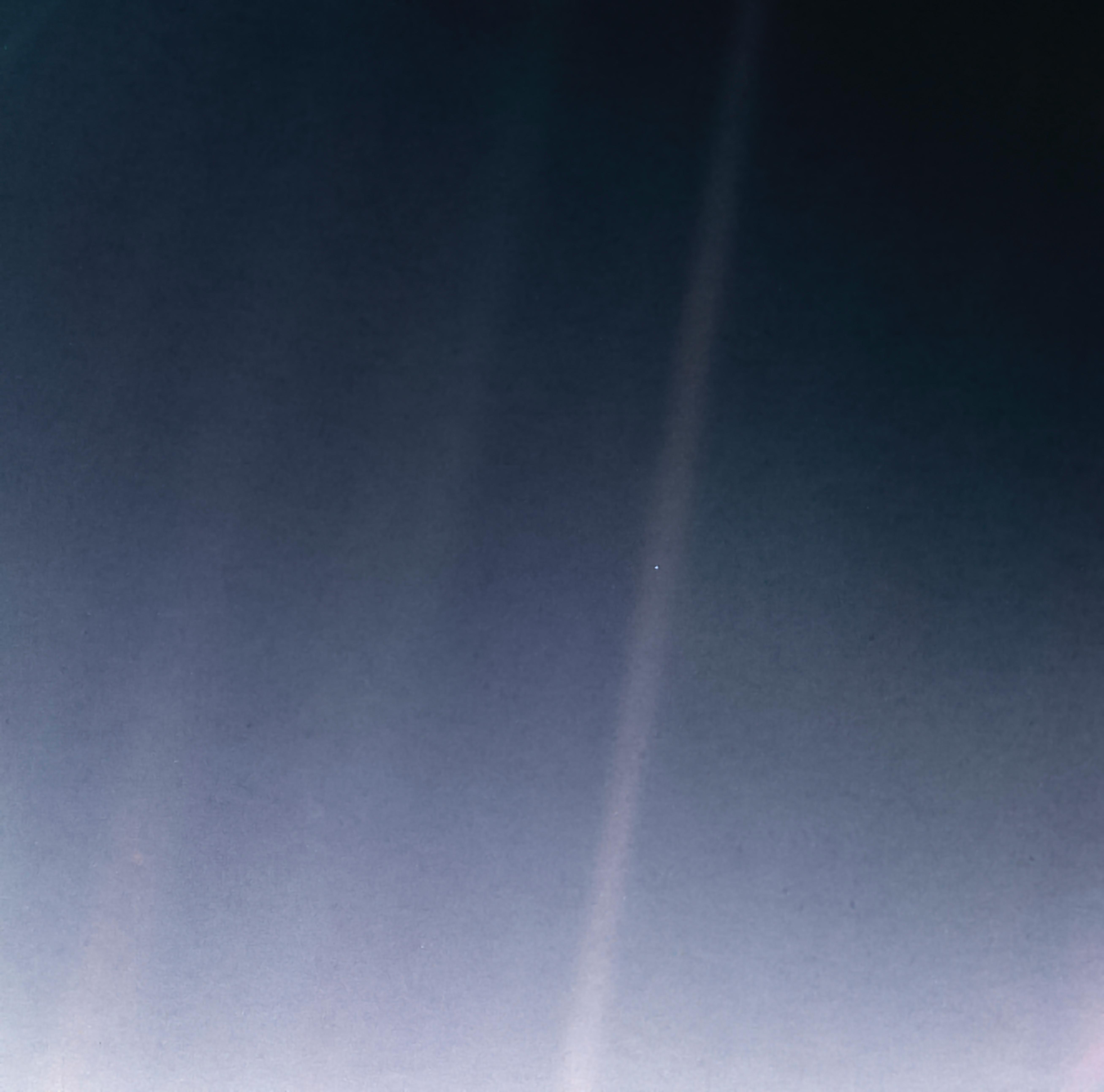 Pale Blue Dot — Earth photographed by Voyager 1 from 6 billion km, remastered 2020. NASA/JPL-Caltech.
