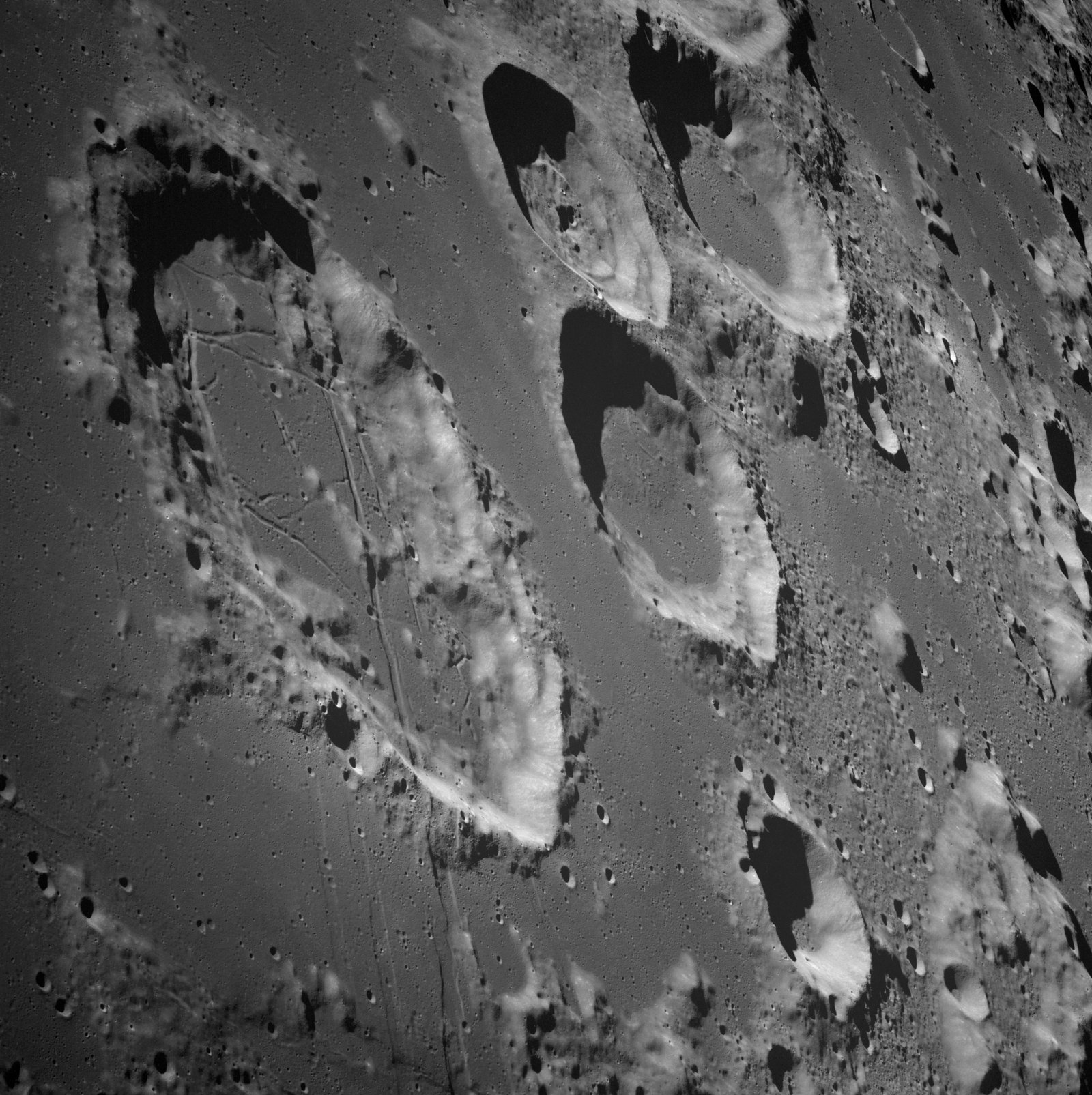 Apollo 8 telephoto image of crater Tsiolkovsky on the lunar far side with dark mare floor.