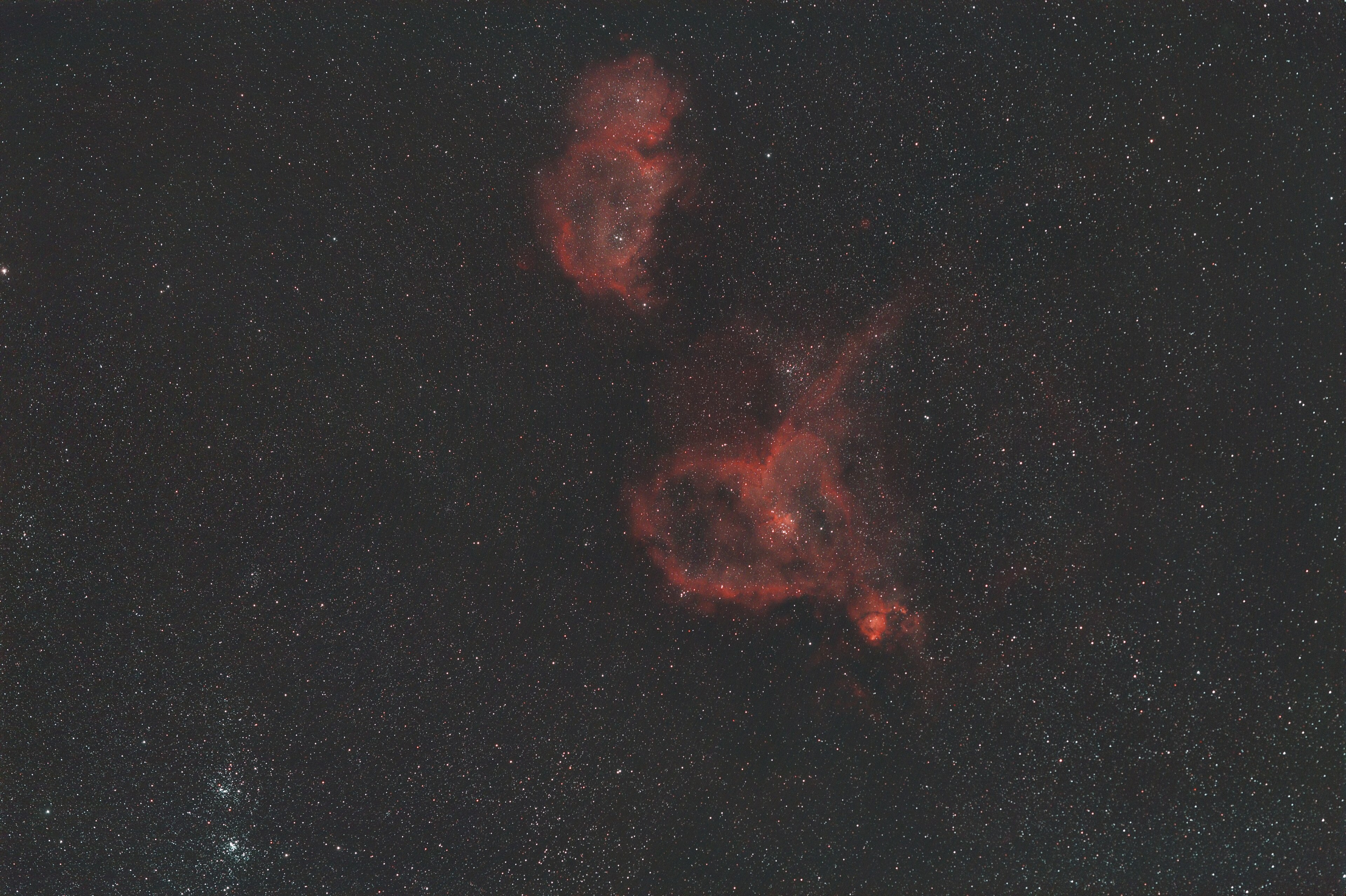 Wide field spanning the Heart and Soul Nebulae in Cassiopeia, with the Double Cluster NGC 869 and NGC 884 at lower left.