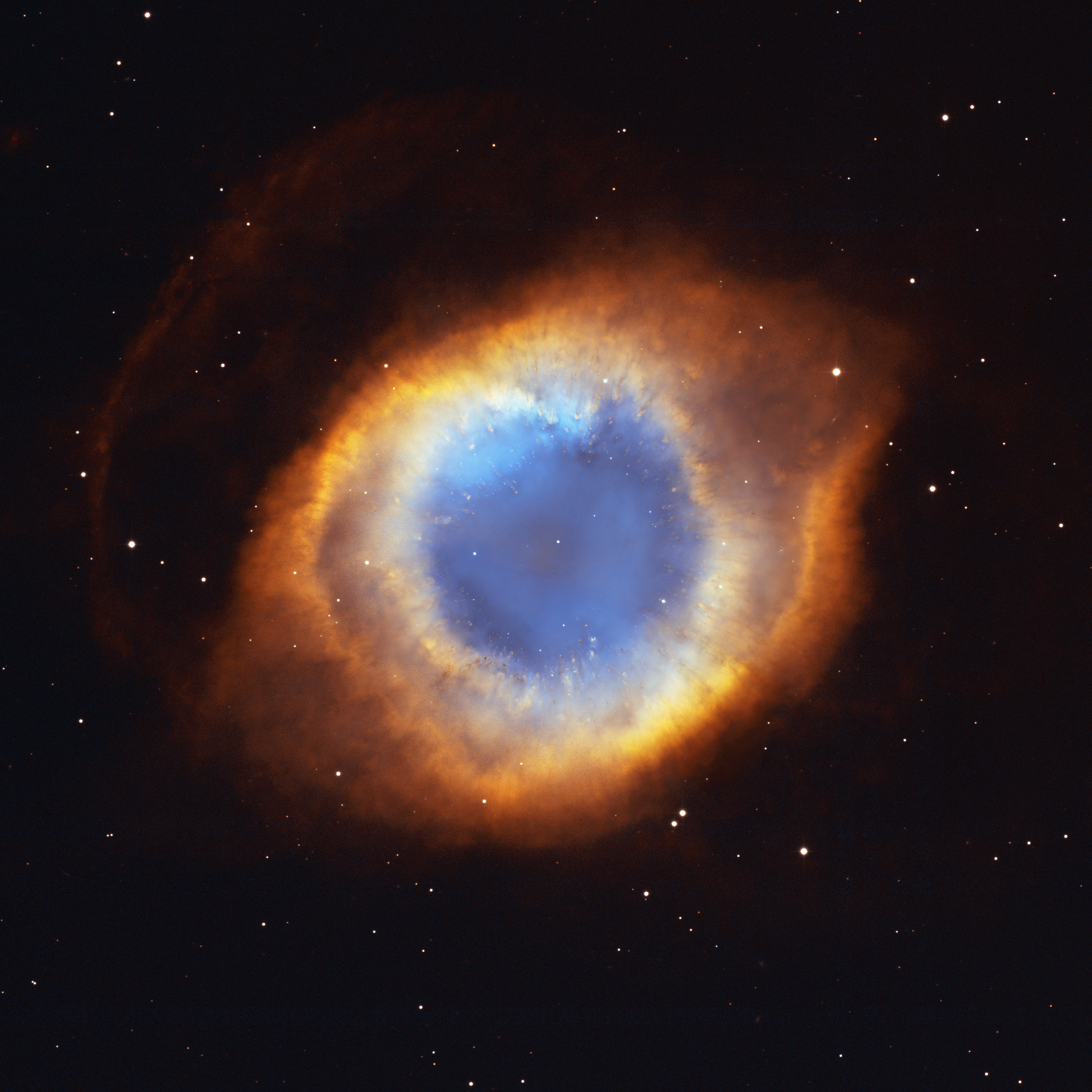 The Helix Nebula, a vast glowing eye of gas cast off by a dying Sun-like star