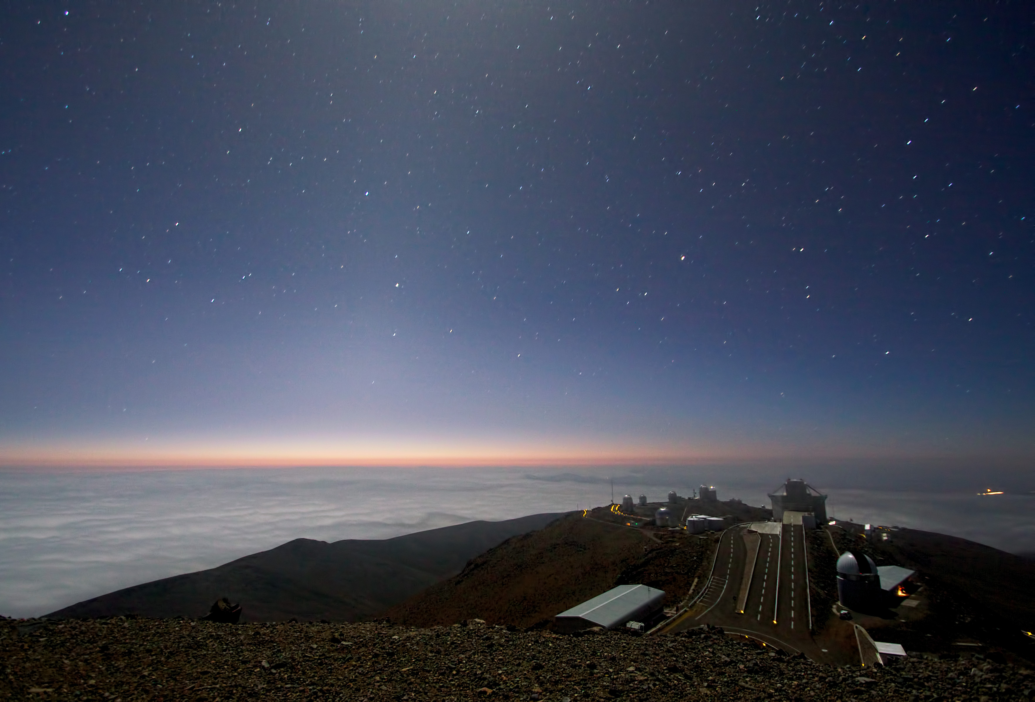 A telescope-friendly dark sky: the night sky glowing over an observatory dome