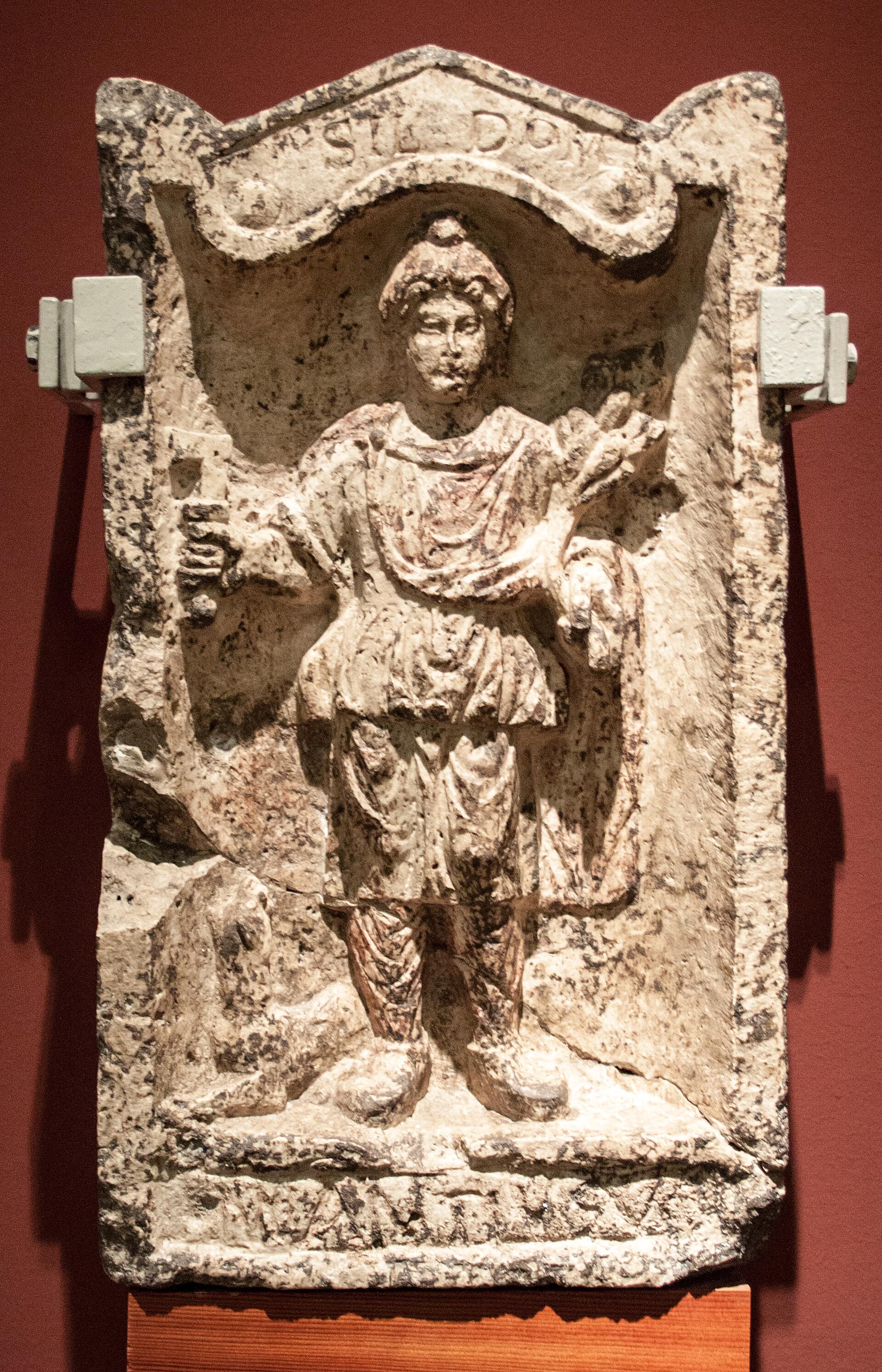 Votive relief of Silvanus with pruning knife, branch and dog